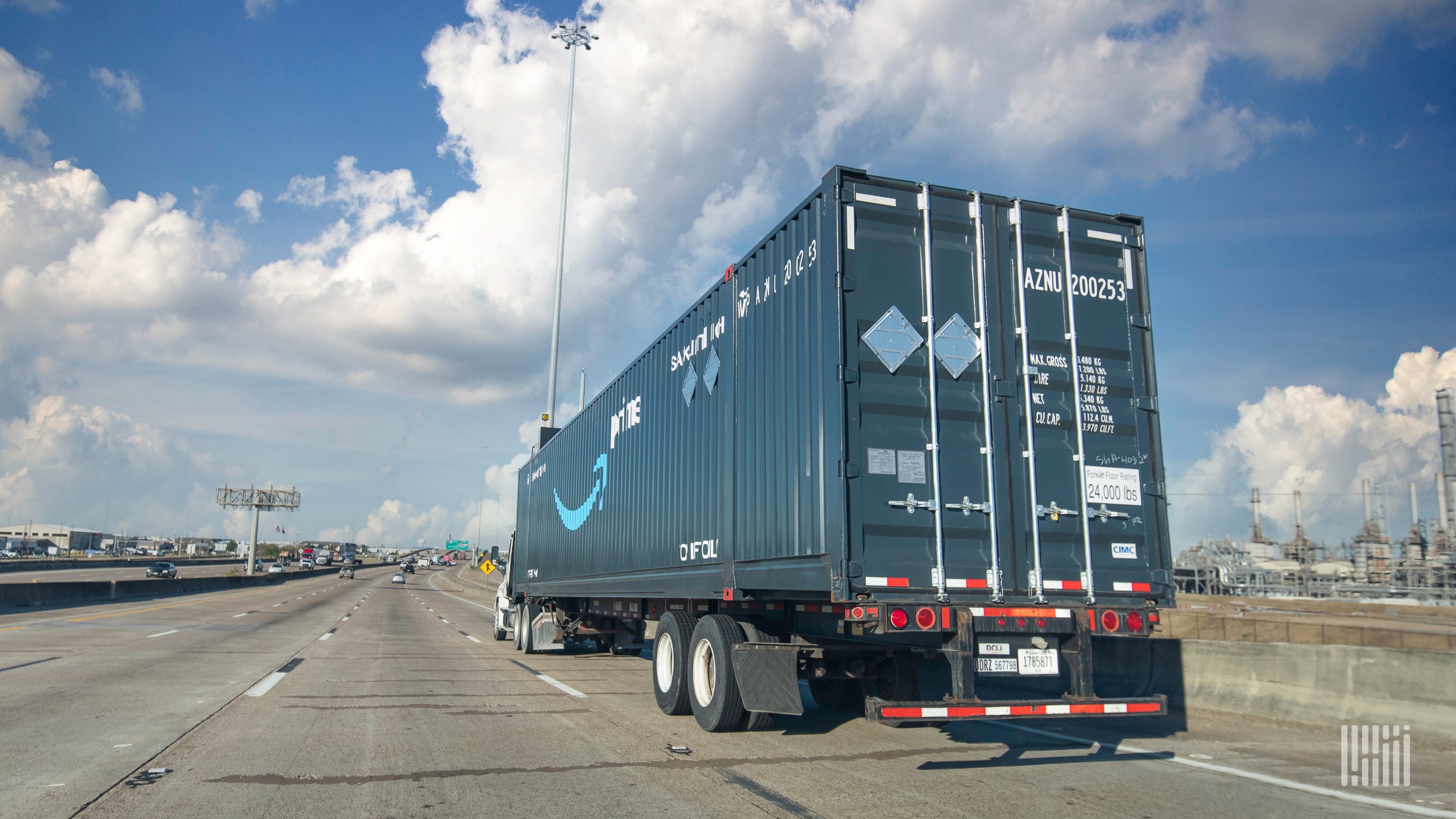 An Amazon Freight truck drives a load down the highway