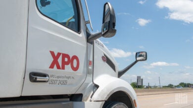 A closeup of an XPO tractor on a highway