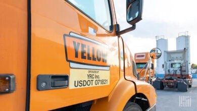 A Yellow tractor parked at a terminal in Houston