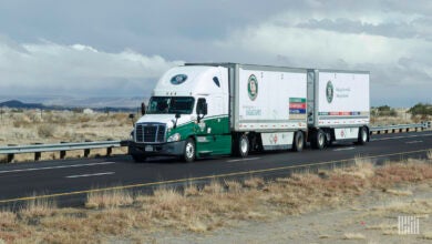 An Old Dominion tractor pulling two OD pup trailers on a highway