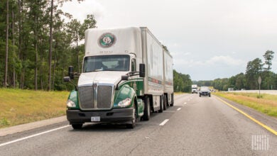 An Old Dominion tractor pulling two pup trailers