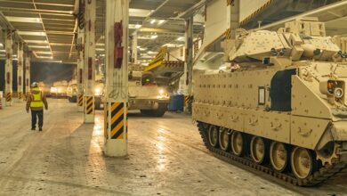 a photo of military vehicle loading operations