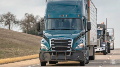 Multiple tractor-trailers on the highway