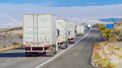 Several tractor-trailers on a highway