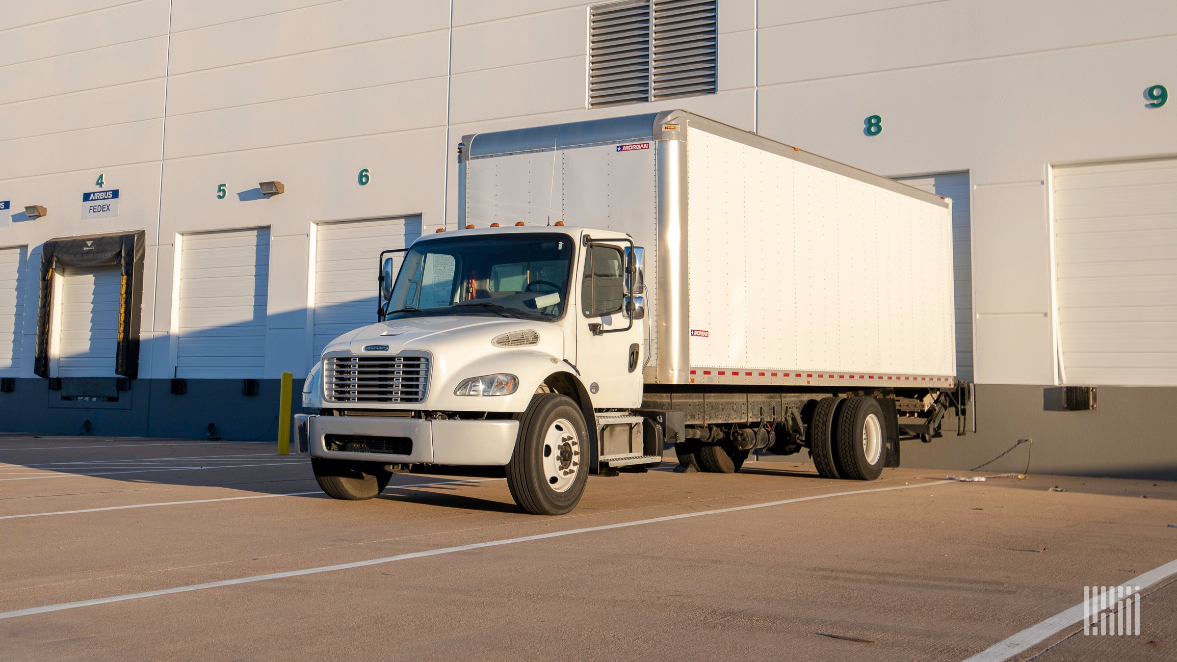 White box truck at loading dock