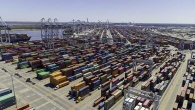 Containers at a marine terminal. Aerial view on a sunny day.